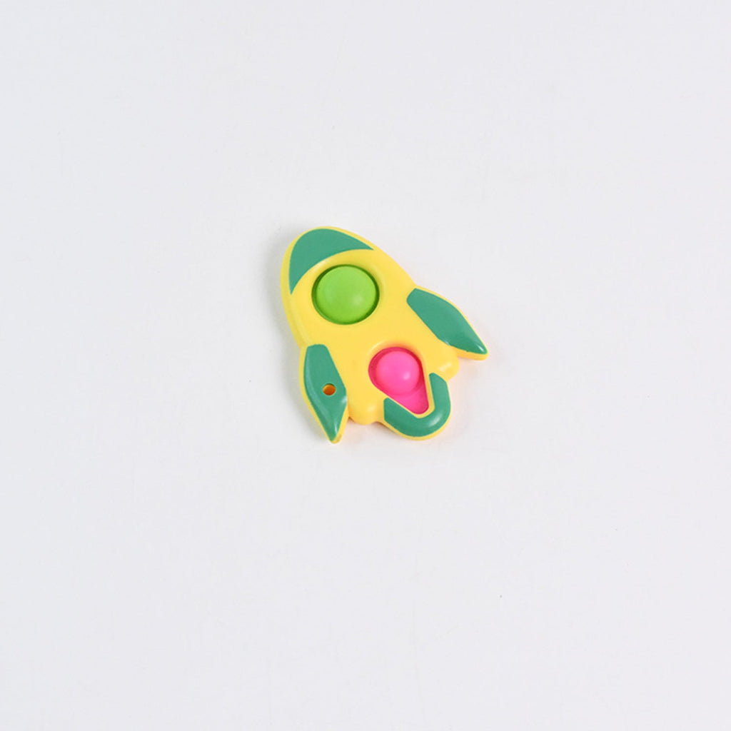 Multiple colorful rocket fidget keychain toys displayed flat on surface
