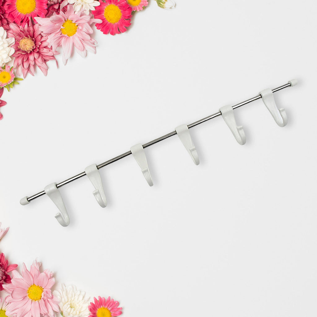 The strong adhesive 'magic stickers' used for secure, nail-free mounting of the utensil hanger rail.