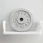 Stylish elephant wall shelf organizing small items on a bathroom wall.