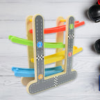 Close-up of the smooth wooden ramps and vibrant mini cars of the play set.