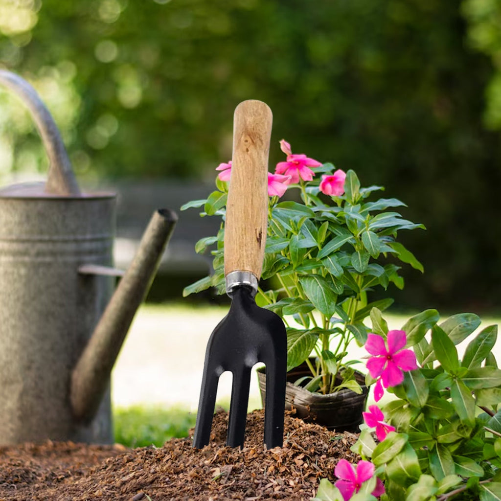 Detailed view of the steel hand weeding fork, showcasing its comfortable and ergonomic handle design.
