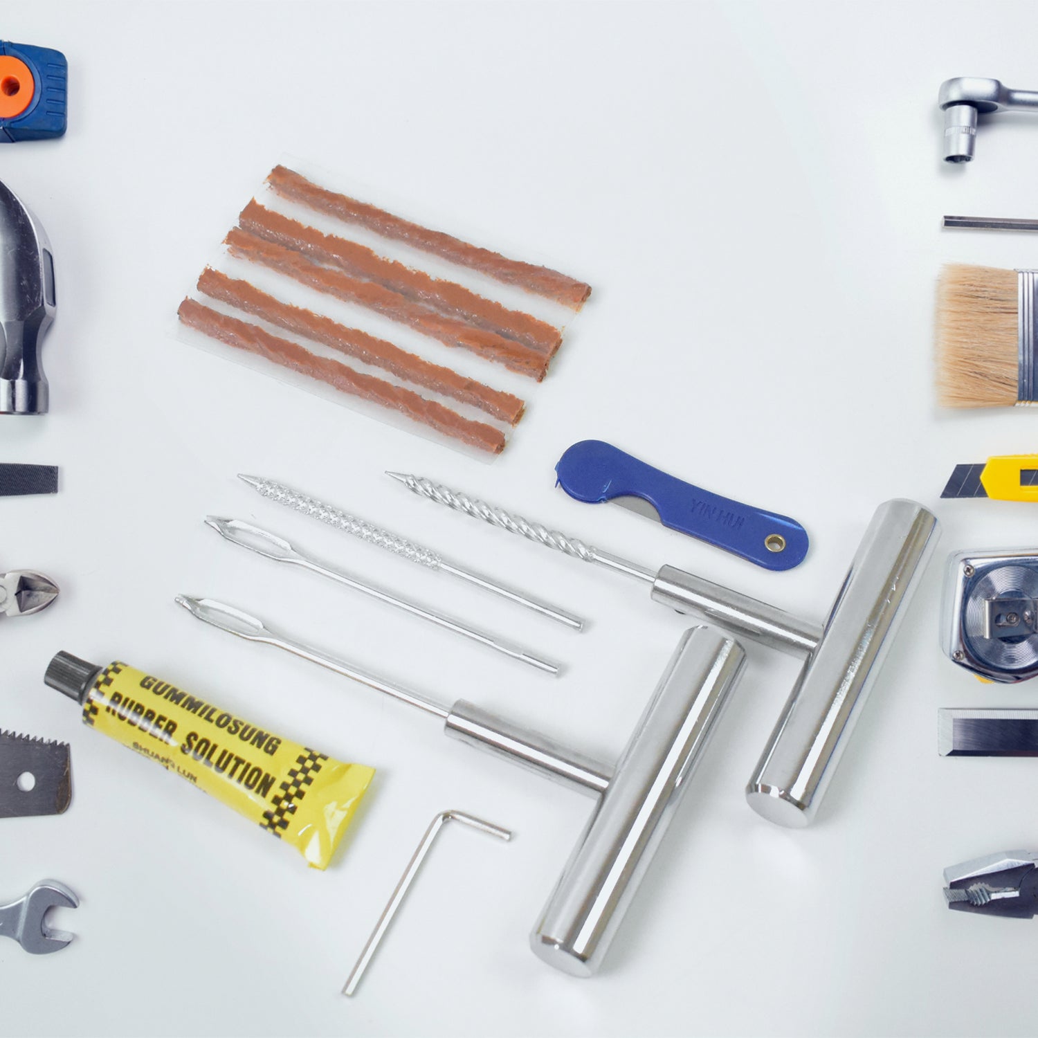 All 13 pieces of the emergency tire repair kit neatly arranged inside its durable storage box.