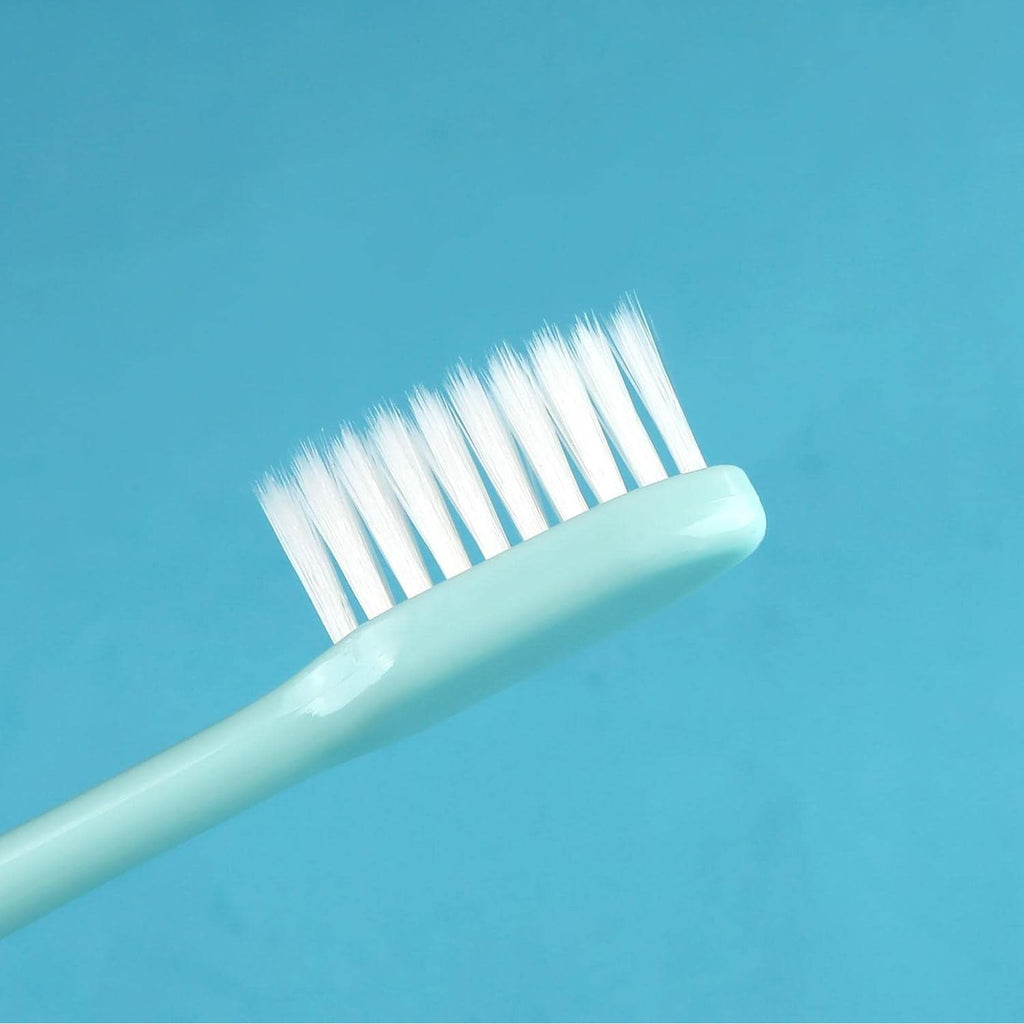 Multiple toothbrushes with soft bristles and protective hygiene covers