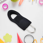 A convenient zipper extension attached to luggage, improving accessibility and grip for travel.