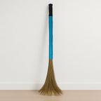 Close-up view of floor broom head with synthetic bristles