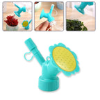 Water flow from plastic bottle nozzle sprinkler head for gentle plant watering
