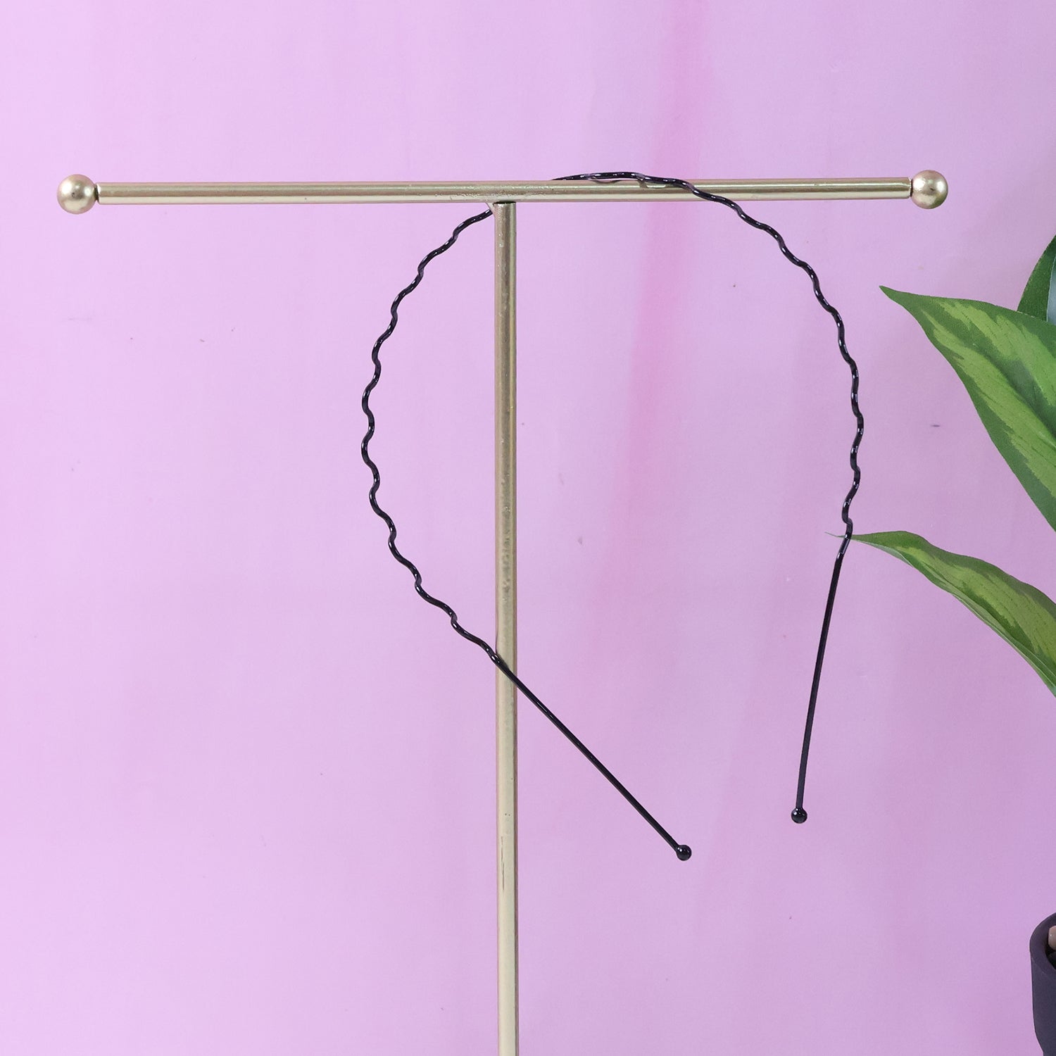 Individual metal wave hair band showing rounded protective tips