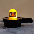 Water Sensor LED Shivling idol illuminating a home altar.
