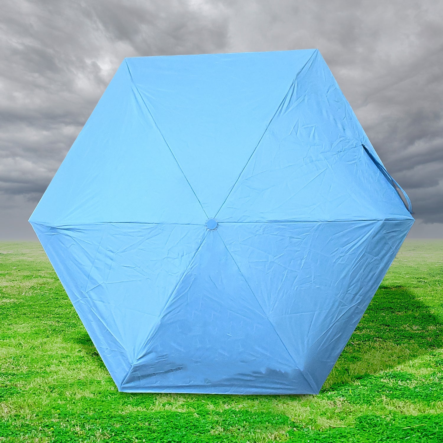 The 5-Fold Umbrella perfectly tucked inside its protective capsule case for easy carrying.