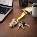 Decorative teddy bear keychain with love strap used as a bag charm