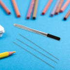An auto-feeding mechanical pencil held in hand, demonstrating its comfortable grip.