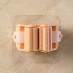 Holder clip firmly securing cleaning tools on wall