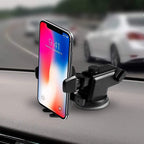 The universal adjustable car mount securely holding various smartphone and tablet sizes.