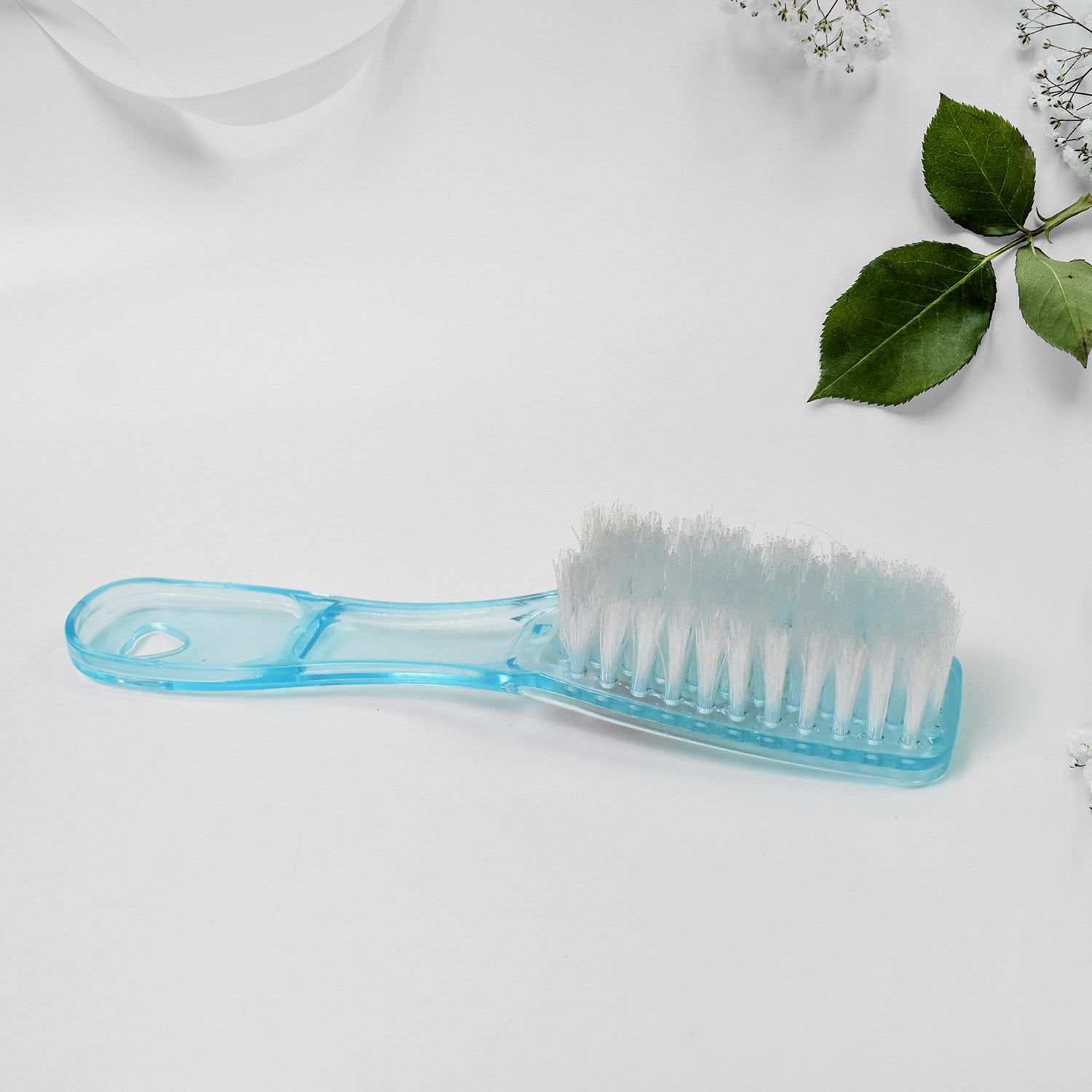 Versatile scrubbing brush demonstrating its multi-use capability.