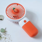 Compact fan suitable for handheld or desktop placement