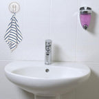 Clear plastic suction cup hook holding decorative hanging items