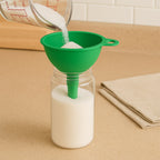 Side profile of the durable silicone funnel on a kitchen counter, highlighting its compact design.