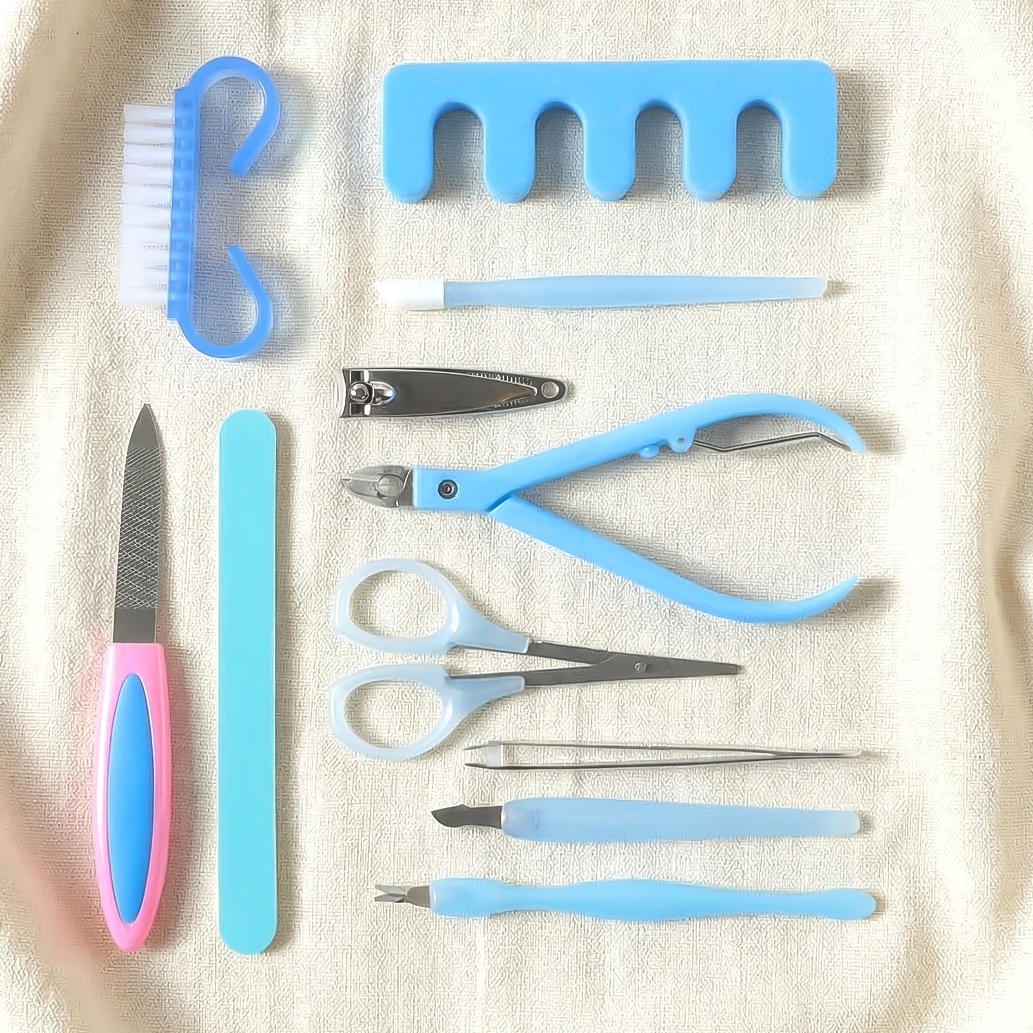 Manicure and pedicure grooming tool set with cleaning brush