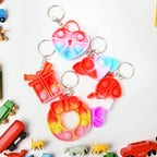A colourful assortment of silicone Pop It Keychains in various shapes for kids.