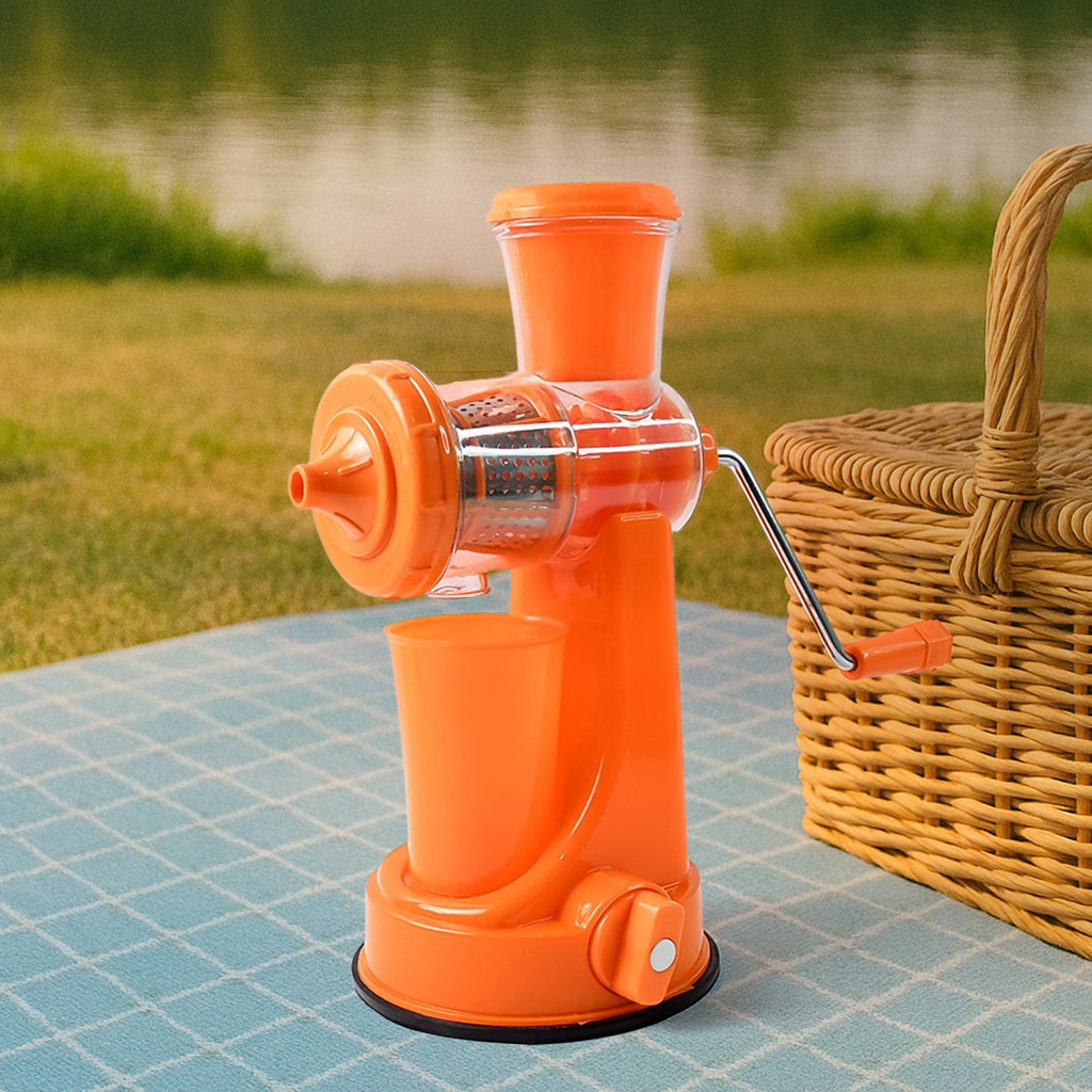 Fresh orange juice being made with the Manual Fruit Juicer, surrounded by oranges.