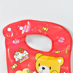 Soft foam lined interior of waterproof baby bib for gentle neck comfort