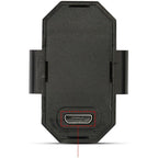 Mini LED strobe light securely mounted on a bicycle wheel, enhancing night-time visibility.