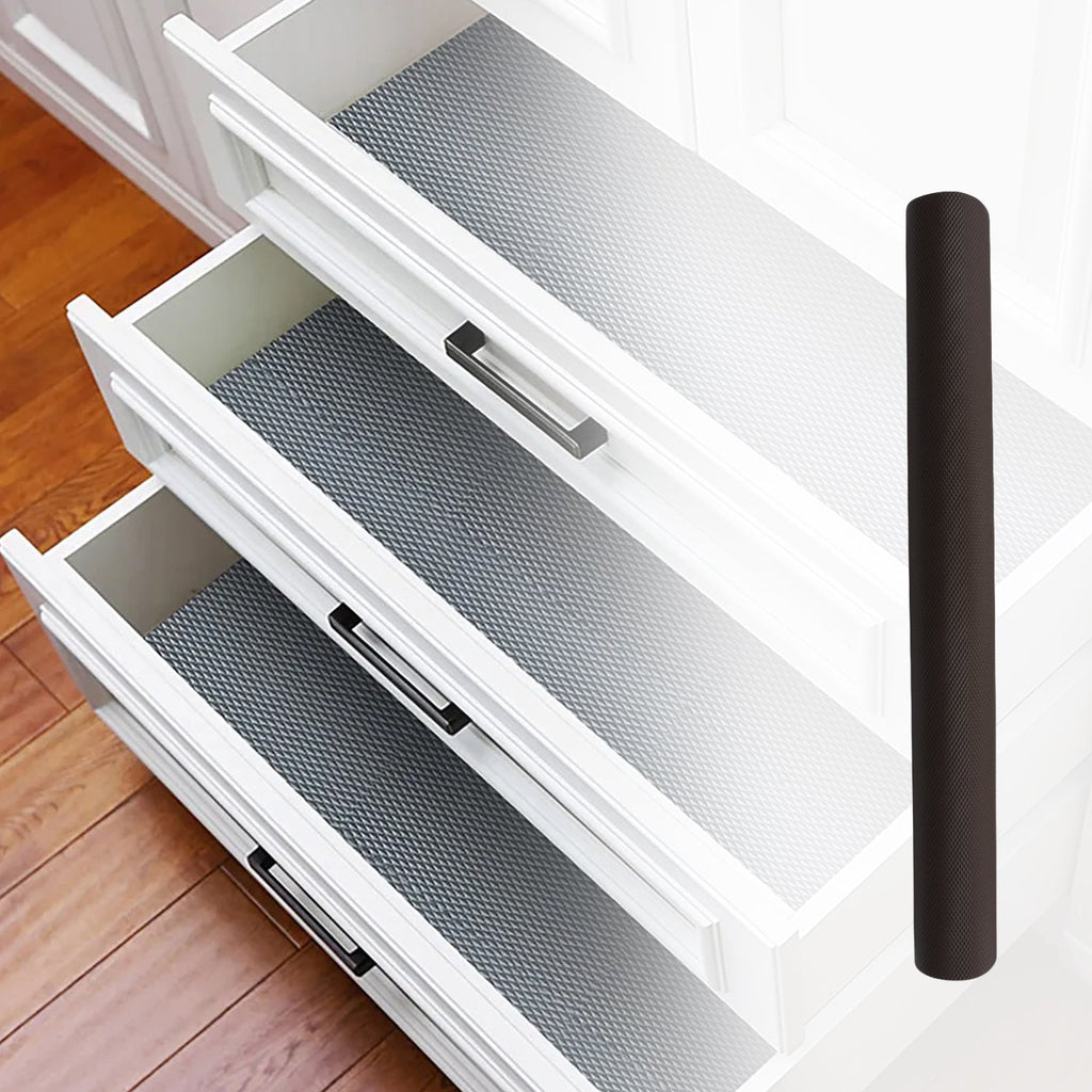 Waterproof anti-slip mat liner roll demonstrated with liquid on a shelf.