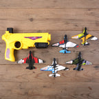 Kids playing with safe foam glider planes and launcher toy