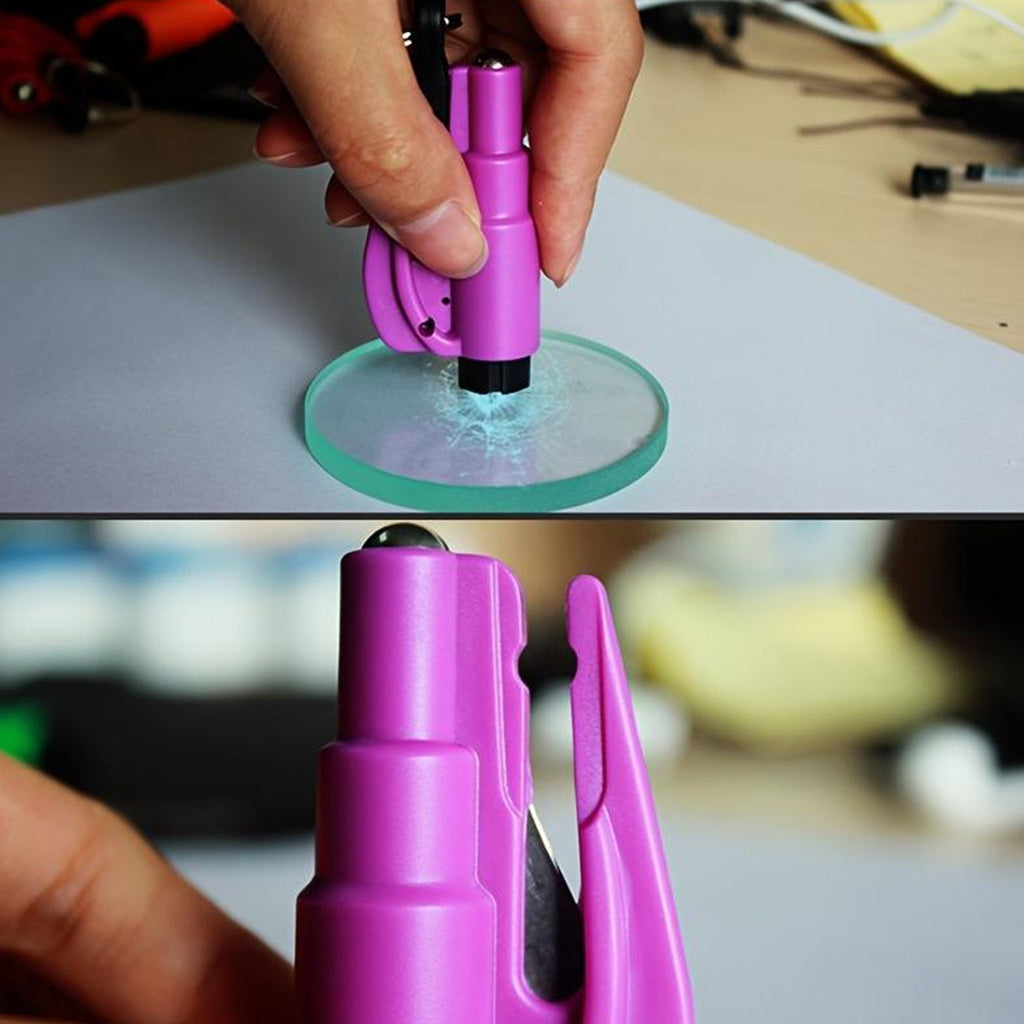 Hand demonstrating the seat belt cutting function of the safety cutter keychain.