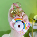 Projective camera keychain from multiple angles on plain white background