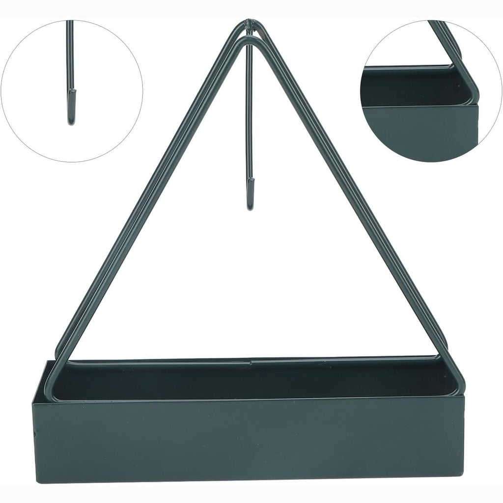 Mosquito coil holder placed flat on an outdoor patio table with greenery.