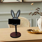 Adjustable Bunny Phone Stand on a desk, showcasing its cute design.