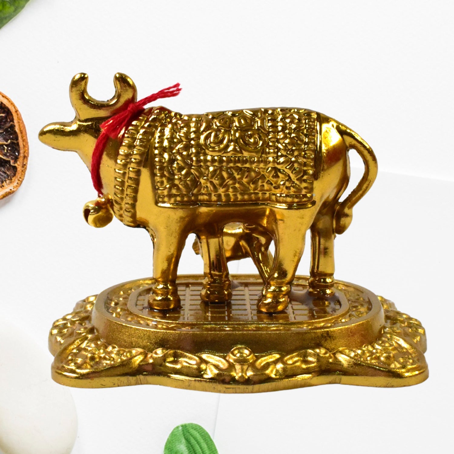 Golden Kamdhenu Cow metal statue symbolizing prosperity