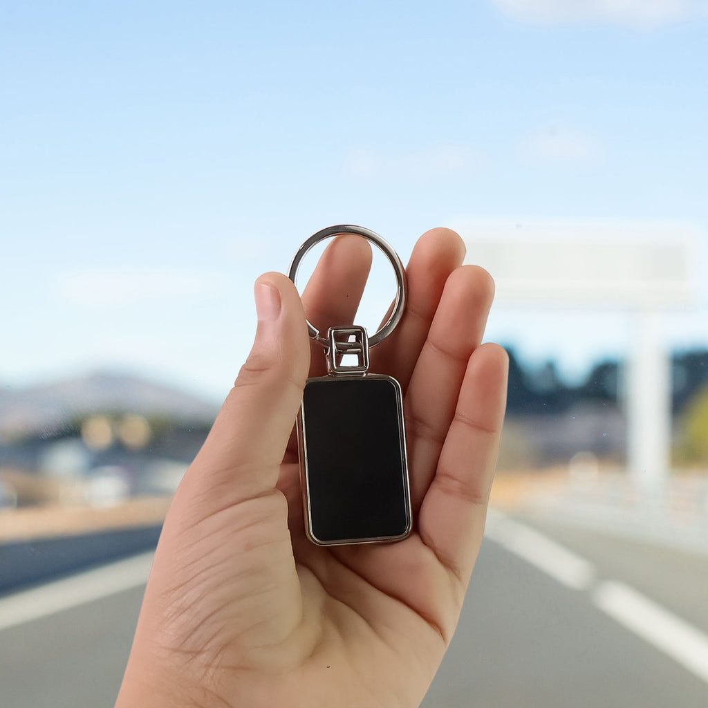 Sleek rectangular metal keychain with polished black and silver edges