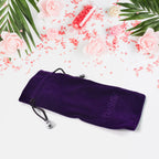 Stylish small fancy gift bag with its drawstring closure visible, ready for packaging.