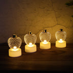 Apple LED tealight candles arranged on a festive backdrop for Diwali decor.
