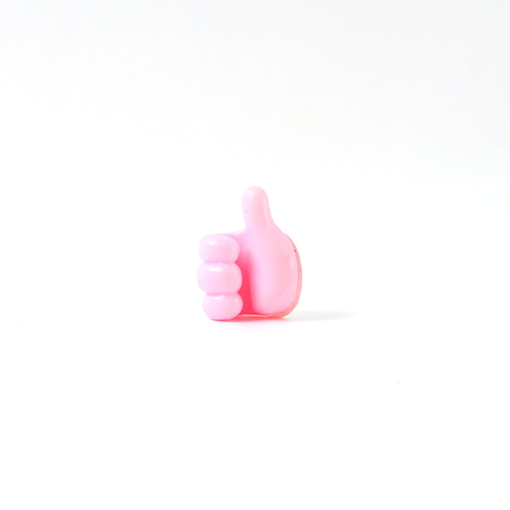 Side profile of pink silicone hand clip wall holder for organizing cables