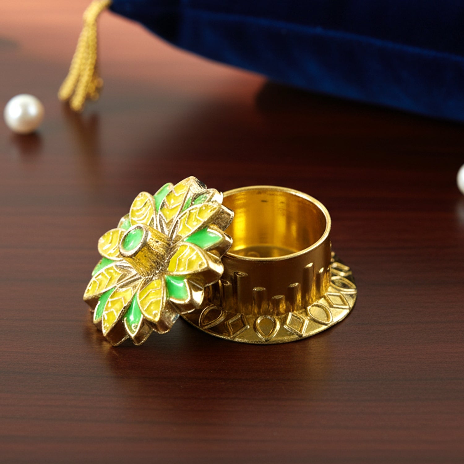 Festive kumkum containers in vibrant colors