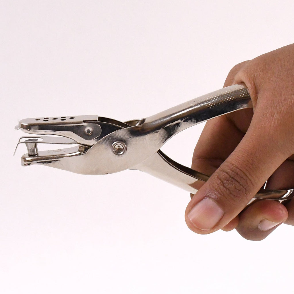 Detailed view of the single hole puncher's spring mechanism for smooth operation.