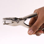 Detailed view of the single hole puncher's spring mechanism for smooth operation.
