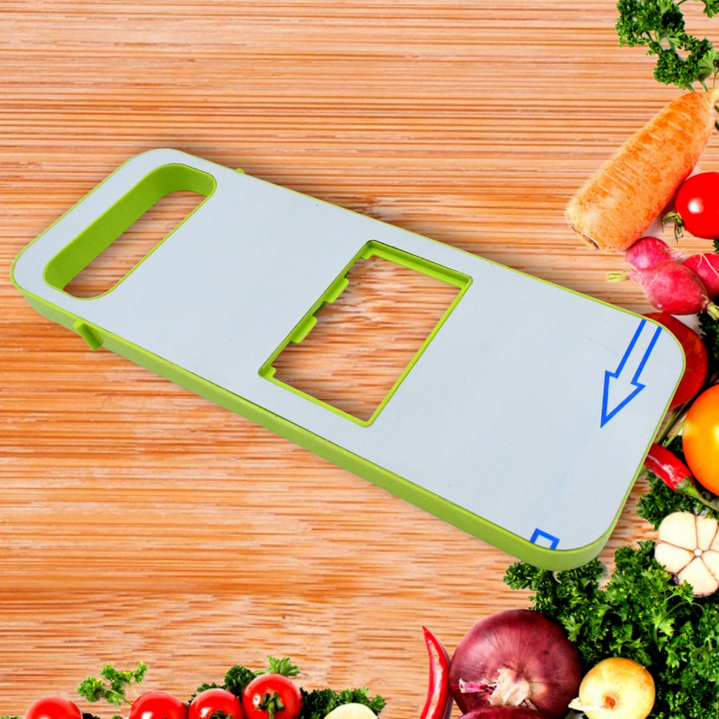 A hand safely operating the foldable vegetable slicer to cut a potato evenly.
