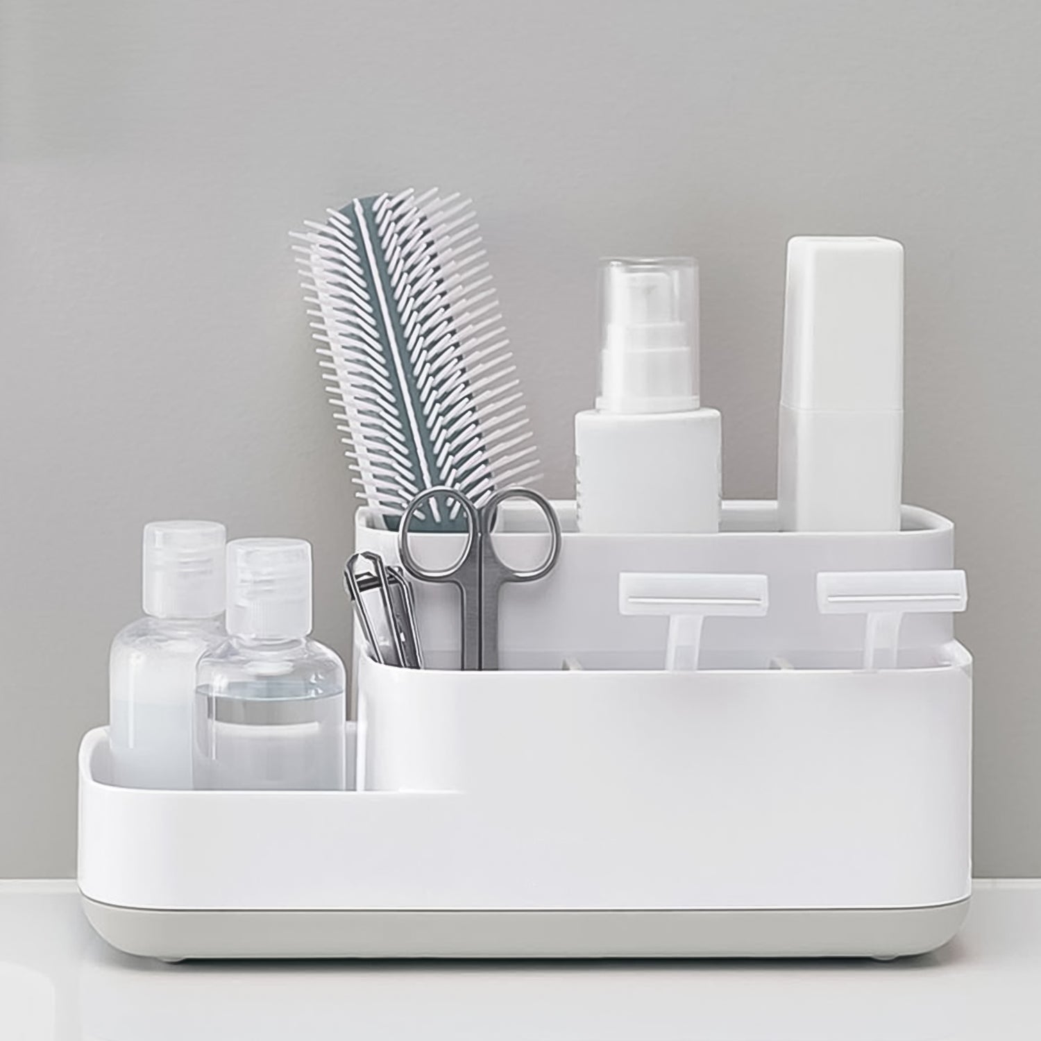 Close-up view of the versatile compartments of the plastic desk organizer.