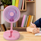 The portable fan in use, providing a cool breeze to a person working outdoors.