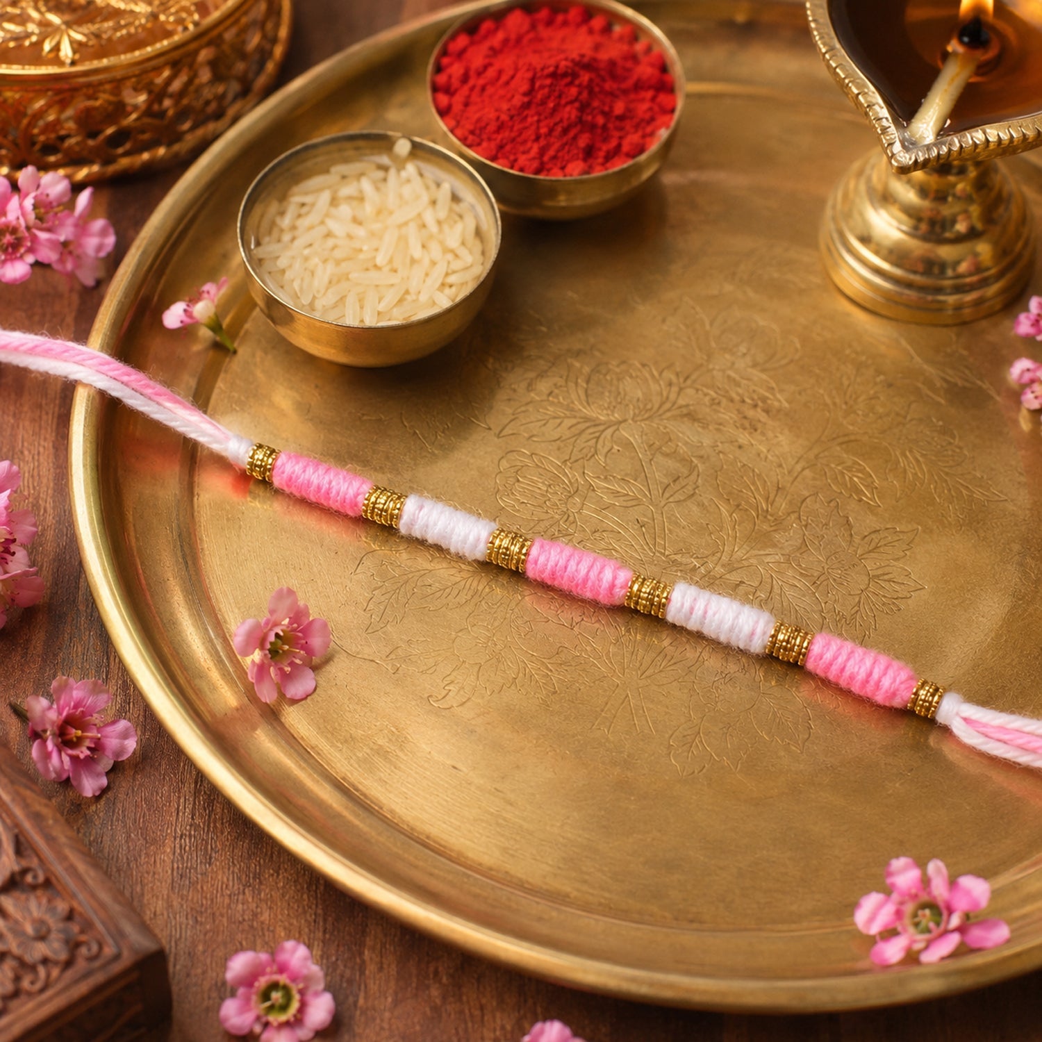 Pink & White Thread Rakhi from side angle