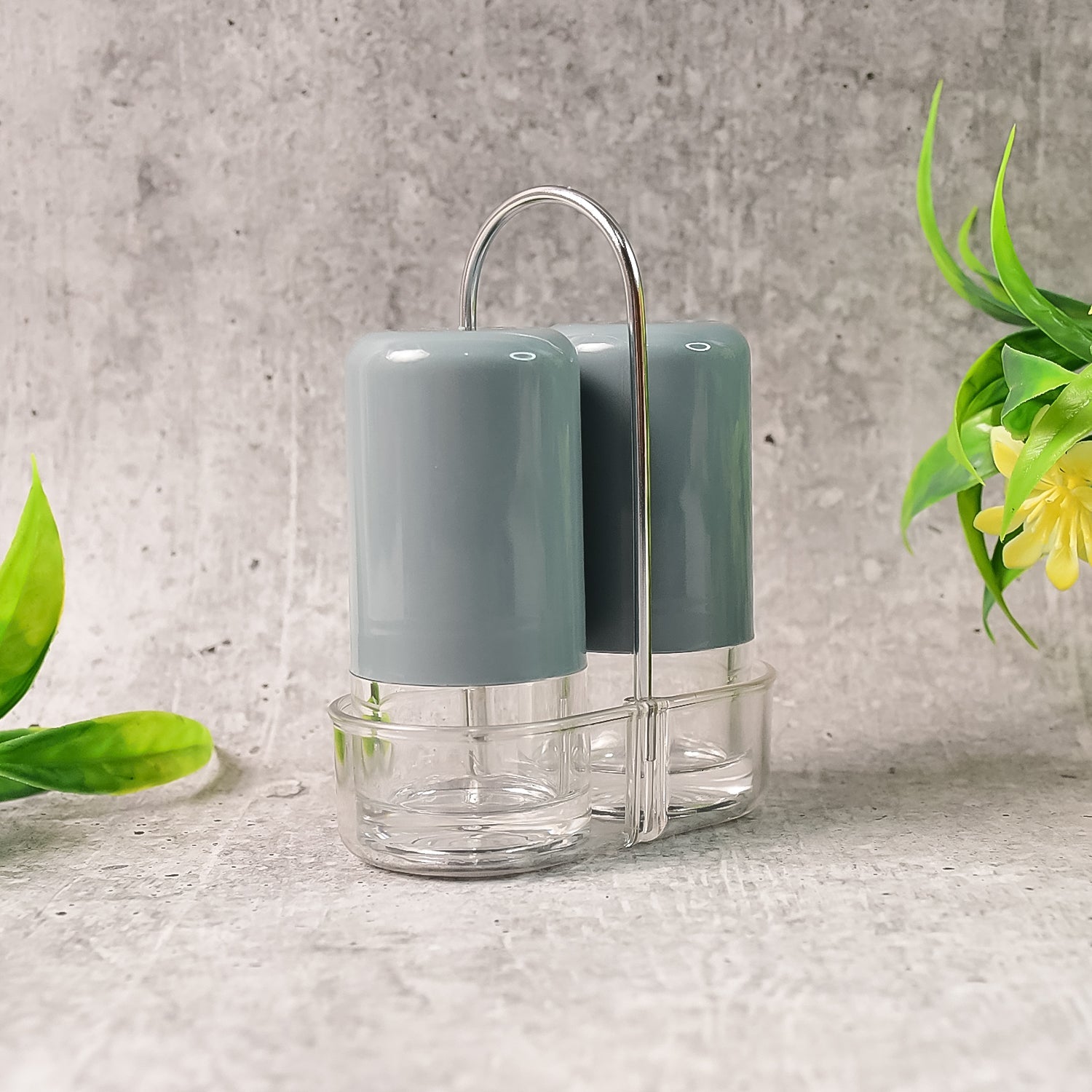 Hand holding an ergonomic acrylic salt shaker for comfortable use