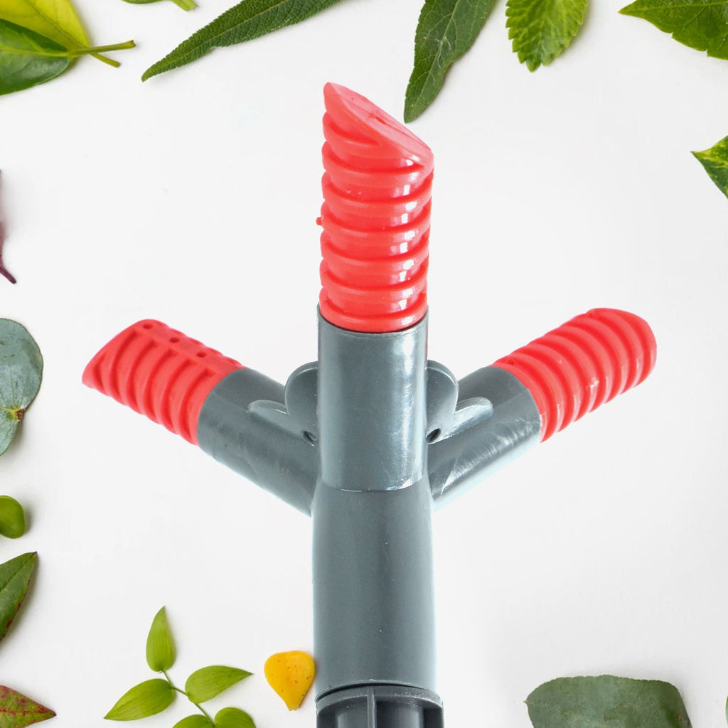 The 360° rotating sprinkler arms distributing water evenly across a yard.