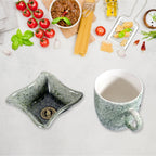 Four-piece ceramic tea and snack bowl set displayed for size reference on a table.