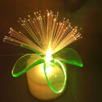Hand holding a fiber optic LED centerpiece, highlighting its compact size.