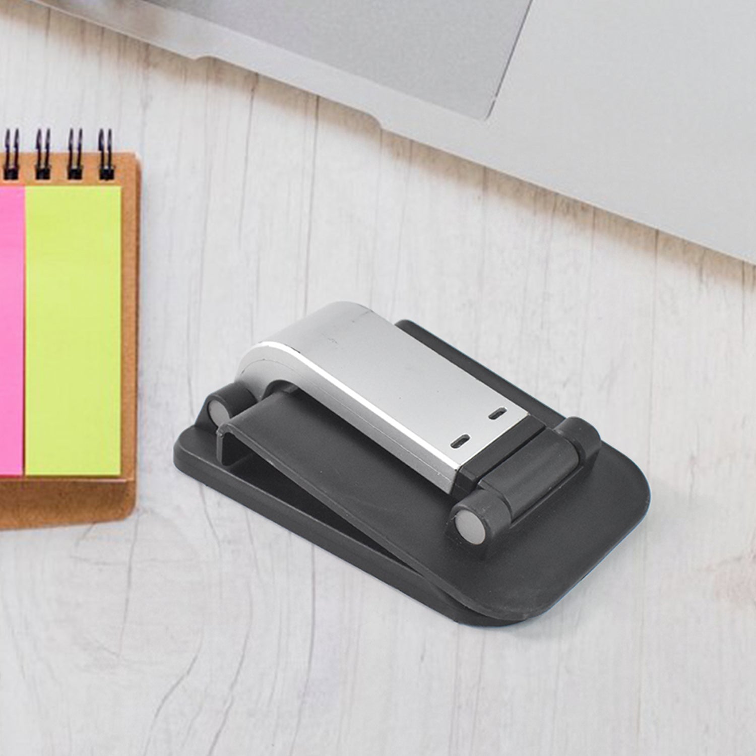 FlexiStand foldable mobile phone holder for desk and bed