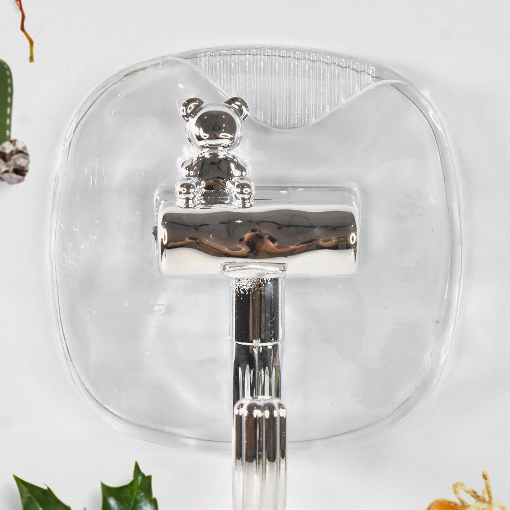 Multi-purpose plastic self adhesive wall hooks attached to cabinet
